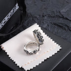 Chrome accessory ring, silver-tone with floral cutout details on the band