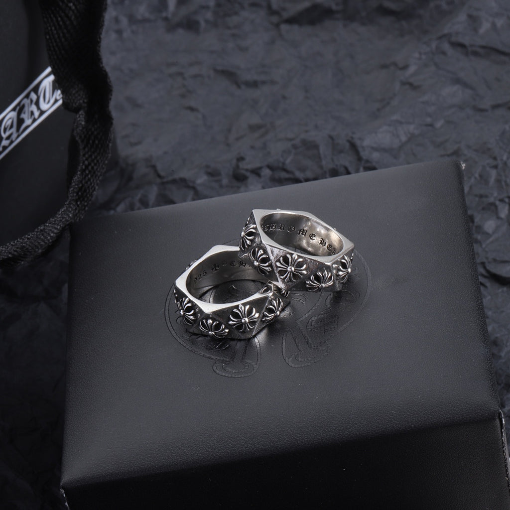 Chrome accessory ring pair, silver-tone bands with floral engraving