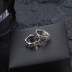 Chrome accessory ring pair, silver-tone bands with floral engraving