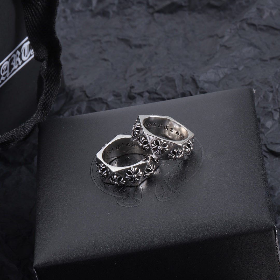 Chrome accessory ring pair, silver-tone bands with floral engraving