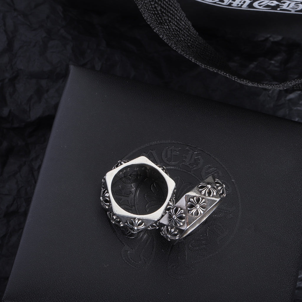 Chrome accessory ring pair, silver-tone bands with floral engraving and scalloped edges