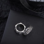 Chrome accessory ring pair, silver-tone bands with floral engraving and scalloped edges
