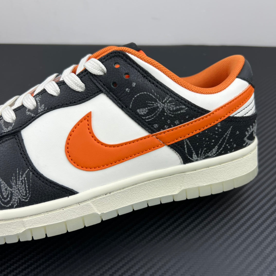 Low-top sneakers angled close-up: white and black upper, orange Swoosh, light sole.