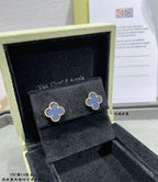 Van Cleef & Arpels quatrefoil stud earrings in box, gold outline with light enamel