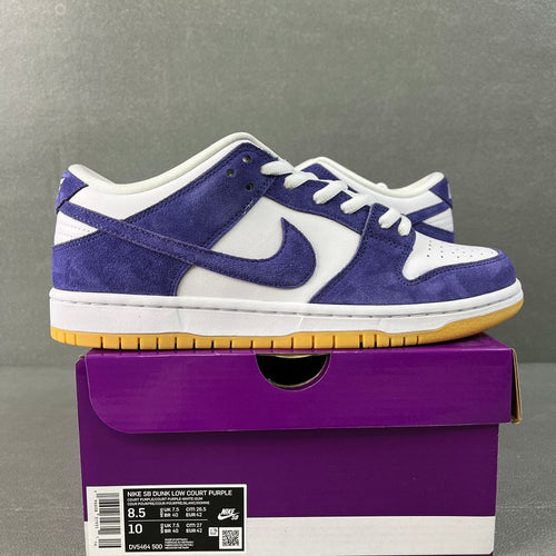 Low-top sneakers with purple suede overlays, white panels, blue swoosh, and gum sole