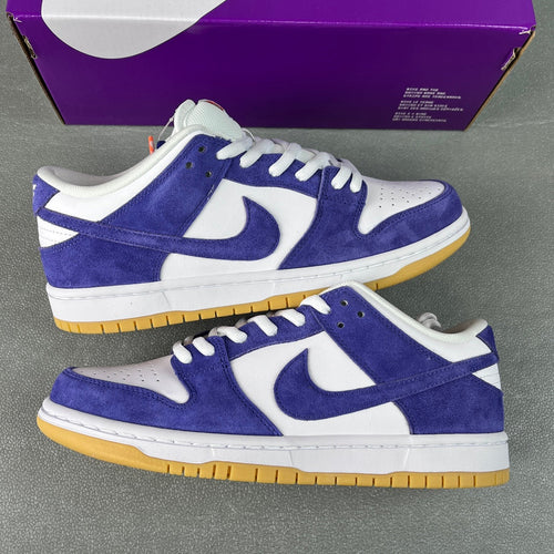 Pair of low-top sneakers, blue-purple suede uppers with white laces and yellow gum sole