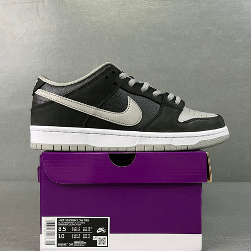 Black low-top skate shoe with white Nike swoosh and light gray lace trim