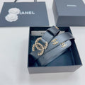 Chanel belt in dark blue leather with gold-toned CC buckle and logo plate