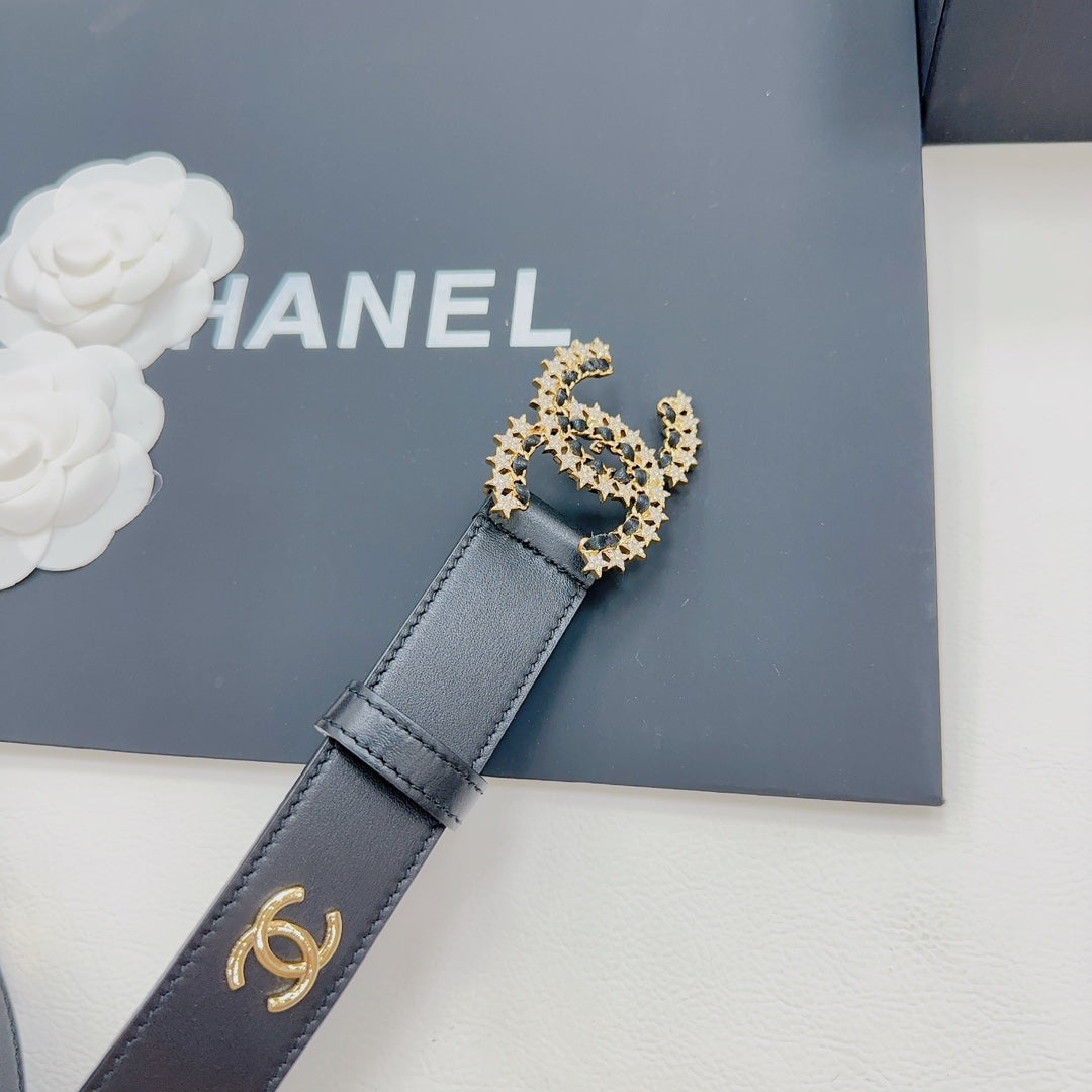 Chanel belt close-up in dark blue leather with gold-toned CC buckle and logo strap