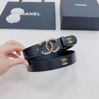 Chanel belt dark blue leather with gold-toned star-like CC buckle and logo keeper