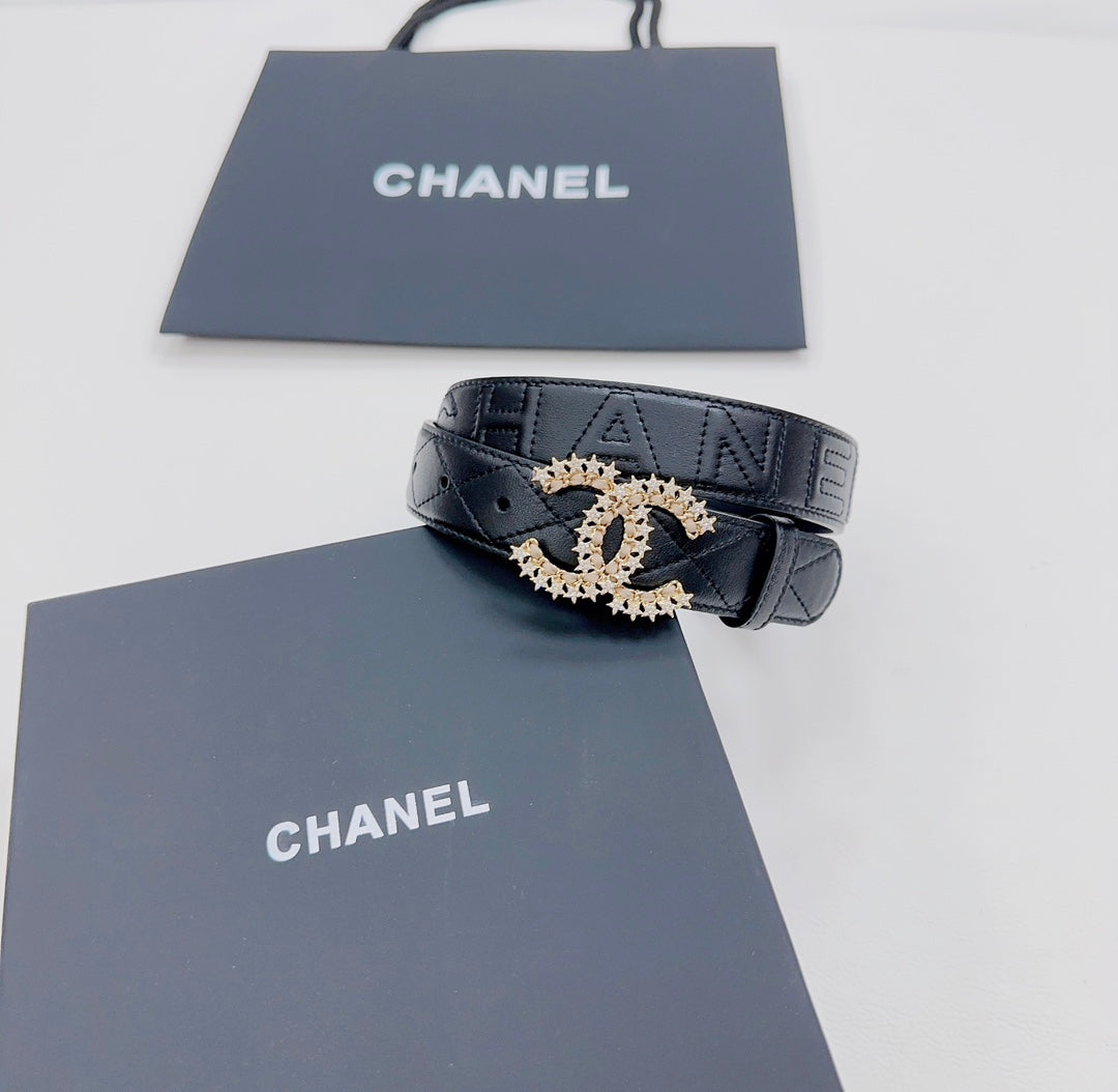 Chanel dark blue leather belt with gold-tone CC buckle and visible quilting on strap