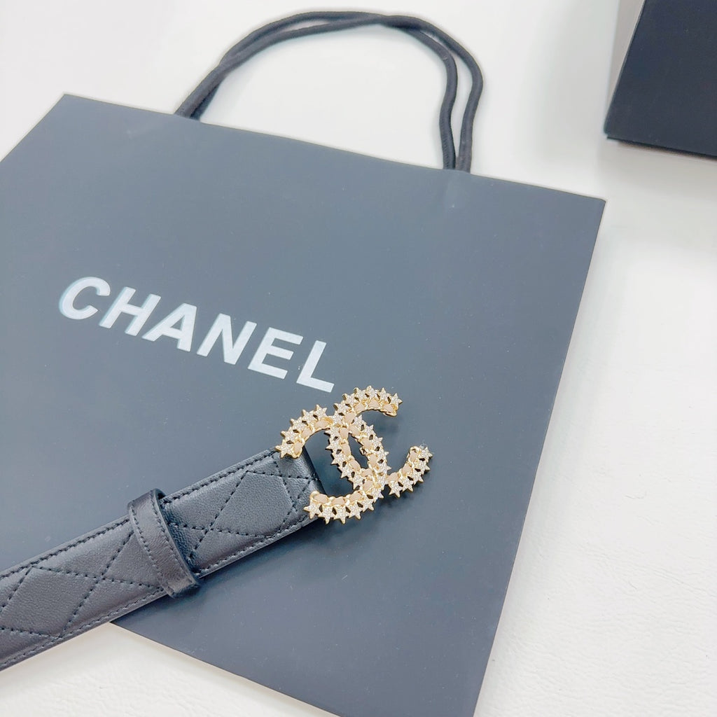 Chanel dark blue leather belt with gold-tone CC buckle on front, laid flat