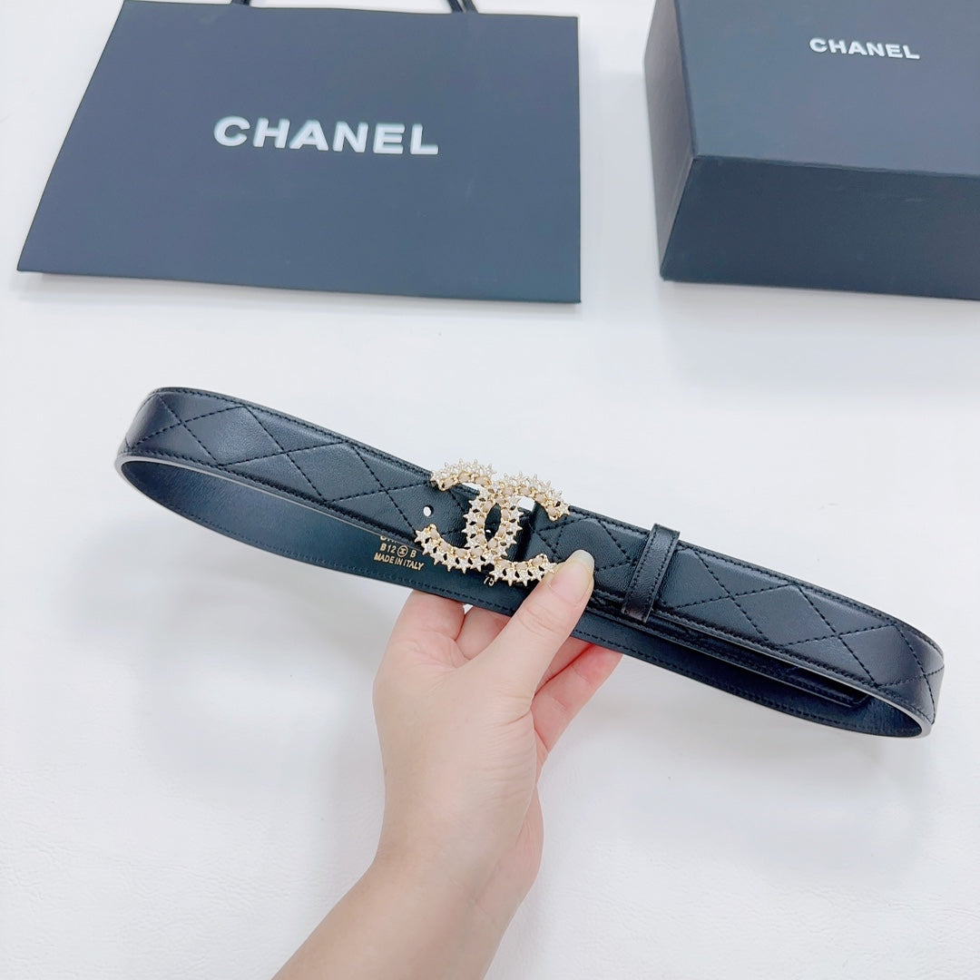 Chanel dark blue leather belt with quilted strap and gold-tone CC buckle, held up