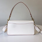 Coah bag, white body with rounded top handle, gold chain links, burgundy trim