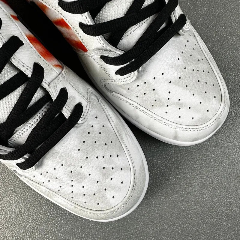 Nike Dunk SB Low Pro QS sneakers, white perforated toe with black laces and stitching