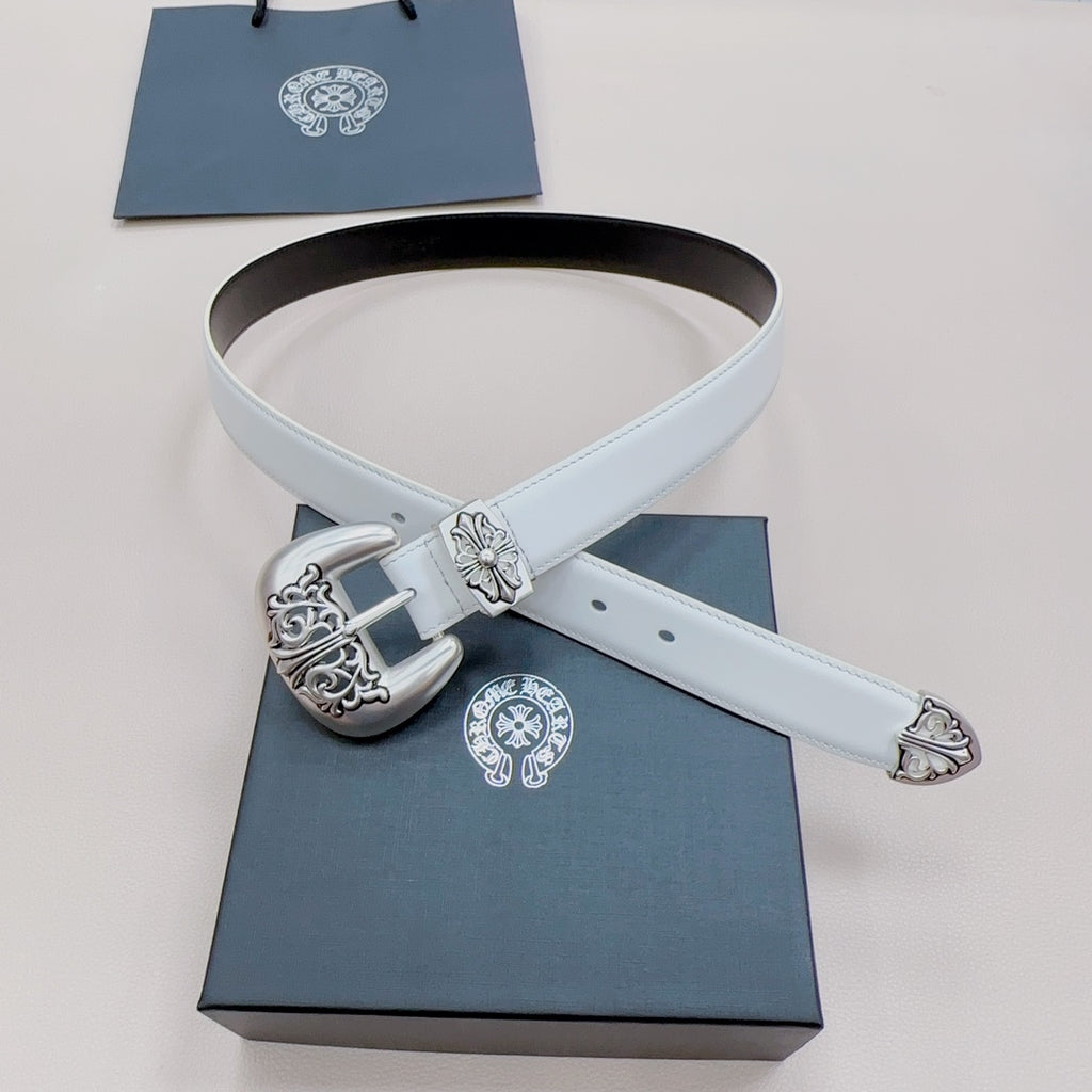 White leather belt with ornate silver buckle and floral keeper detail, laid flat