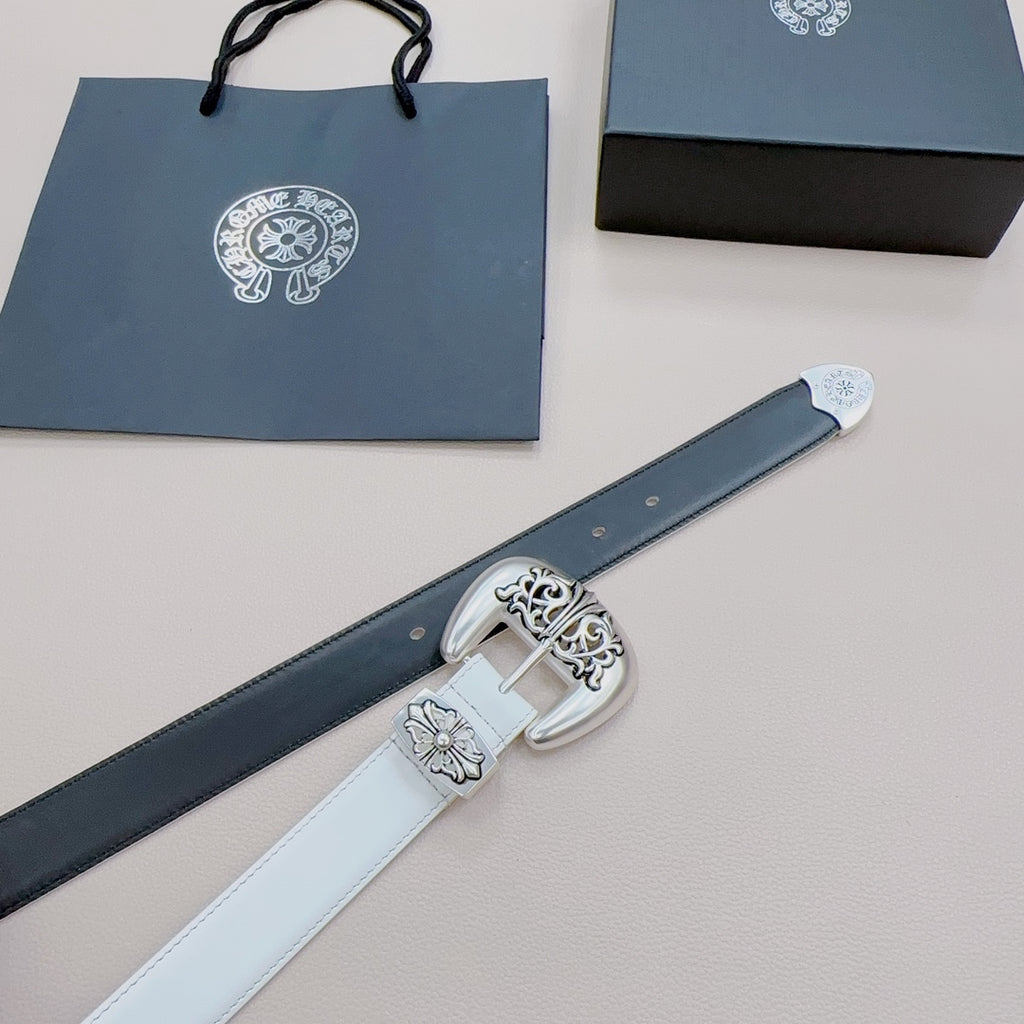 White leather belt with ornate silver buckle and floral engravings on strap