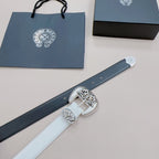 White leather belt with ornate silver buckle and floral engravings on strap