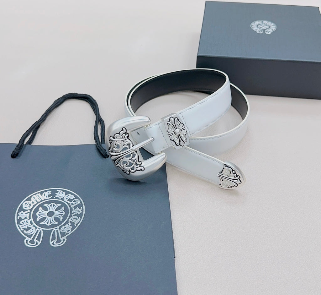 White leather belt with ornate silver buckle and decorative floral detailing