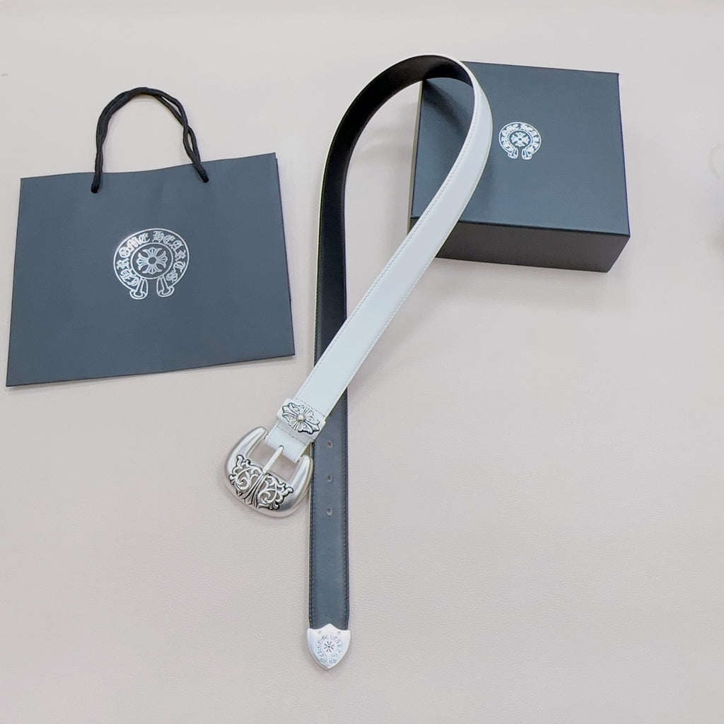 White and dark reversible belt with ornate silver buckle, hanging end and holes