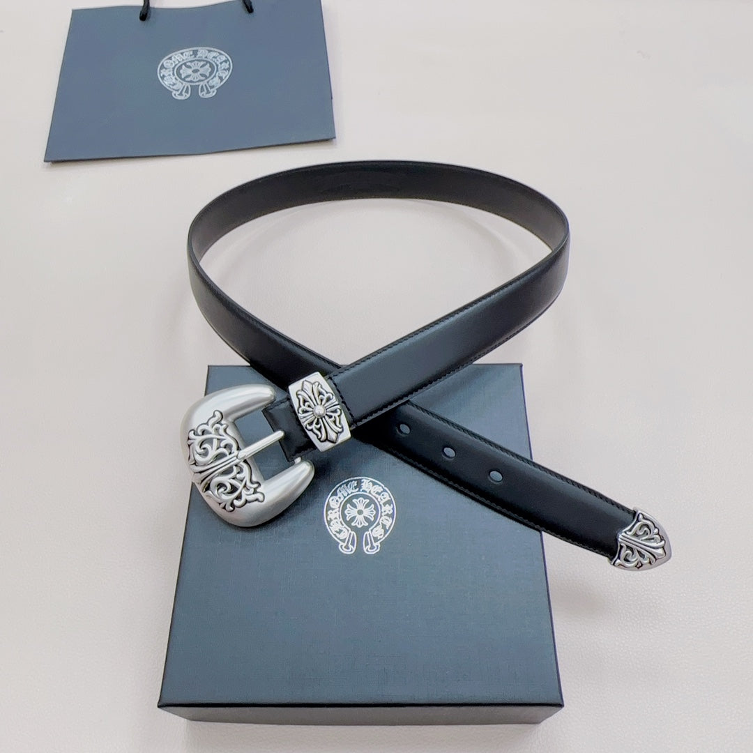 Chrome belt with dark blue leather strap, silver buckle with ornate side scrolls