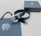 Chrome belt with dark blue leather strap, silver ornate buckle centerpiece and prong