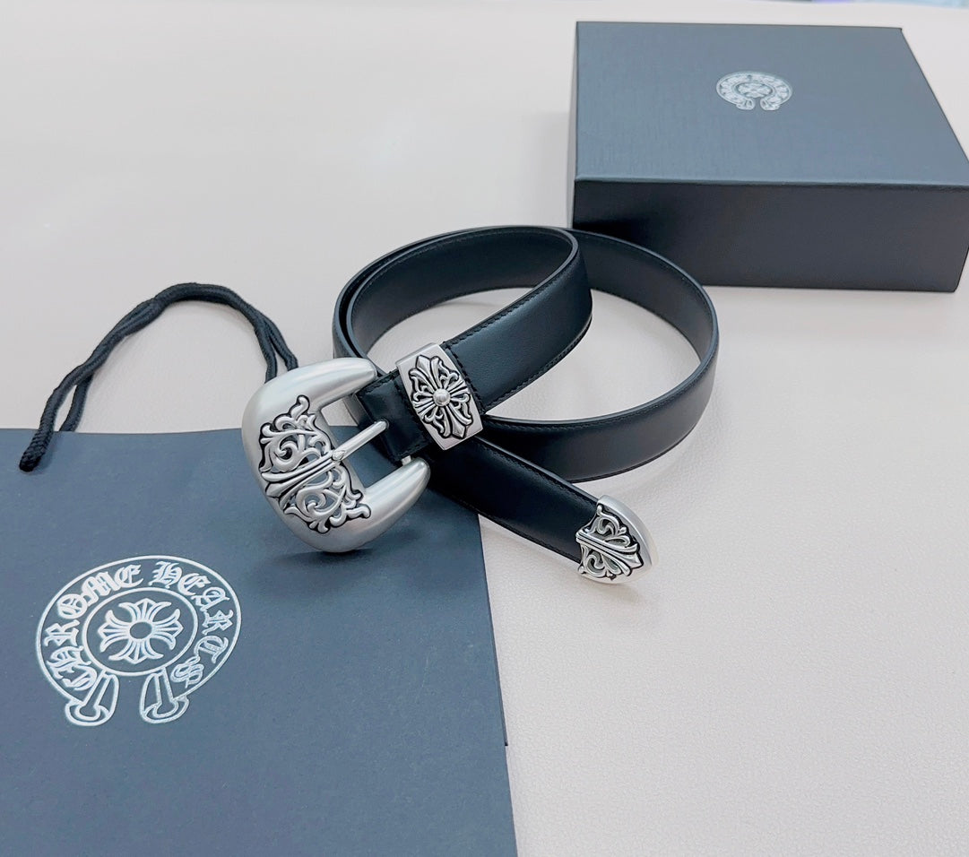 Chrome belt with dark blue leather strap, silver ornate buckle centerpiece and prong