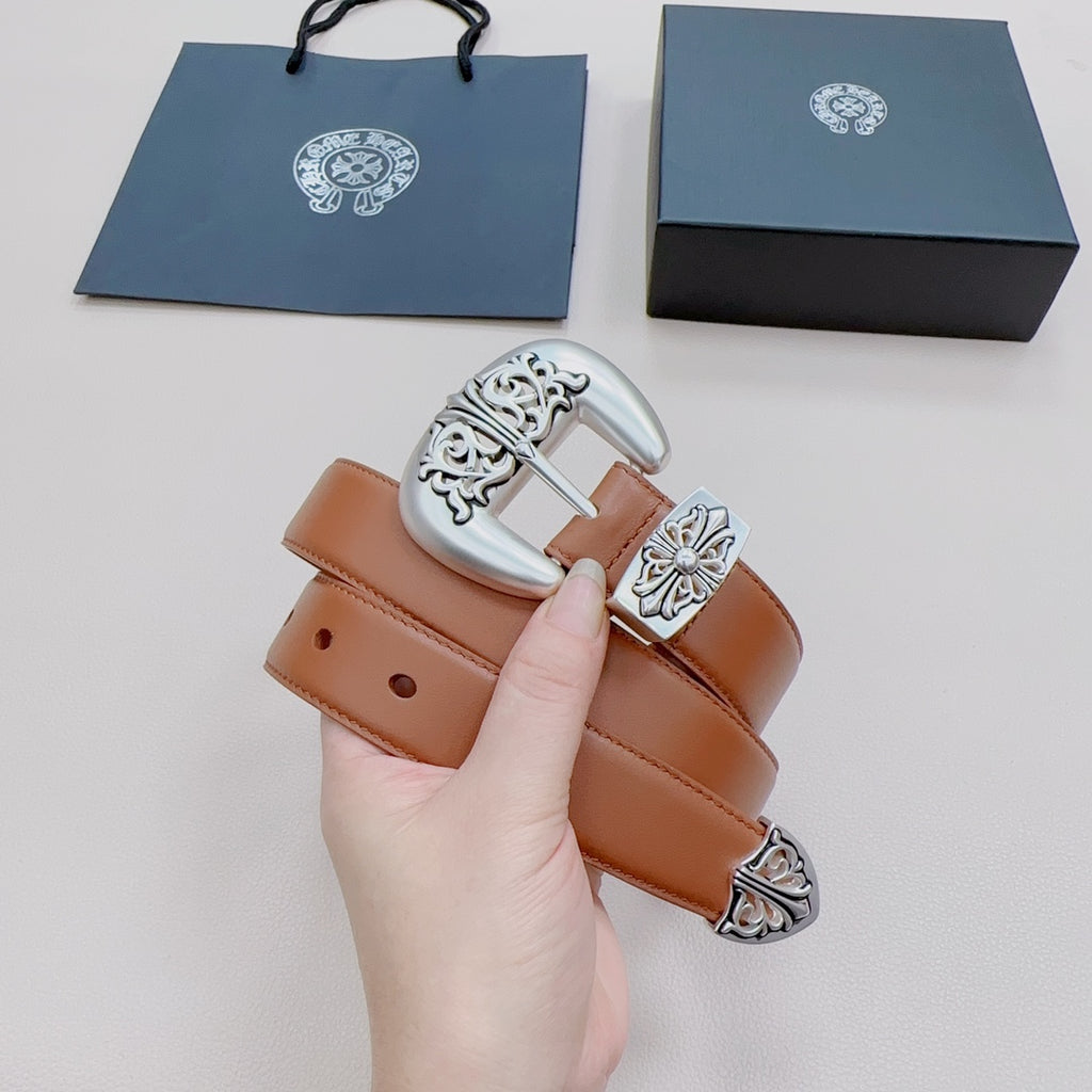 Brown leather belt with decorative silver buckle and floral-style metal side details