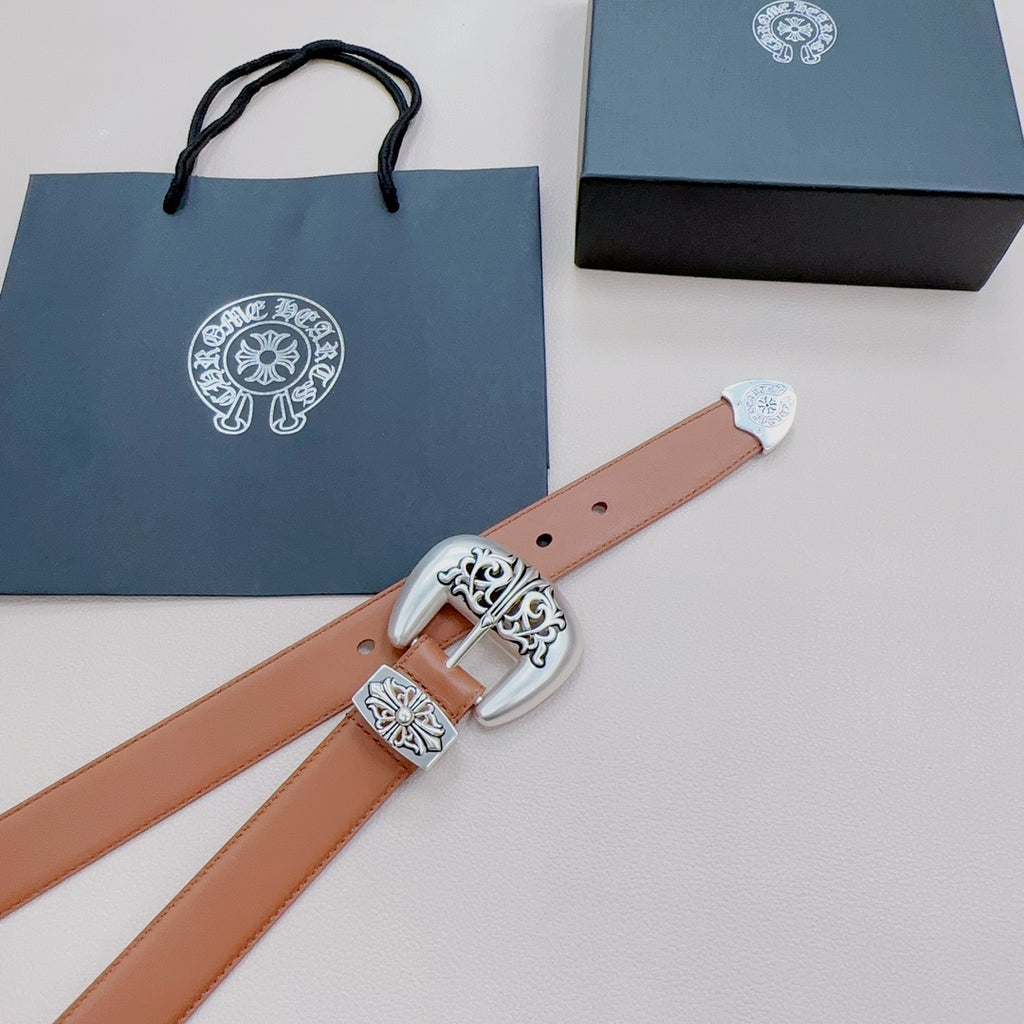 Brown leather belt with ornate silver buckle and engraved floral metal details