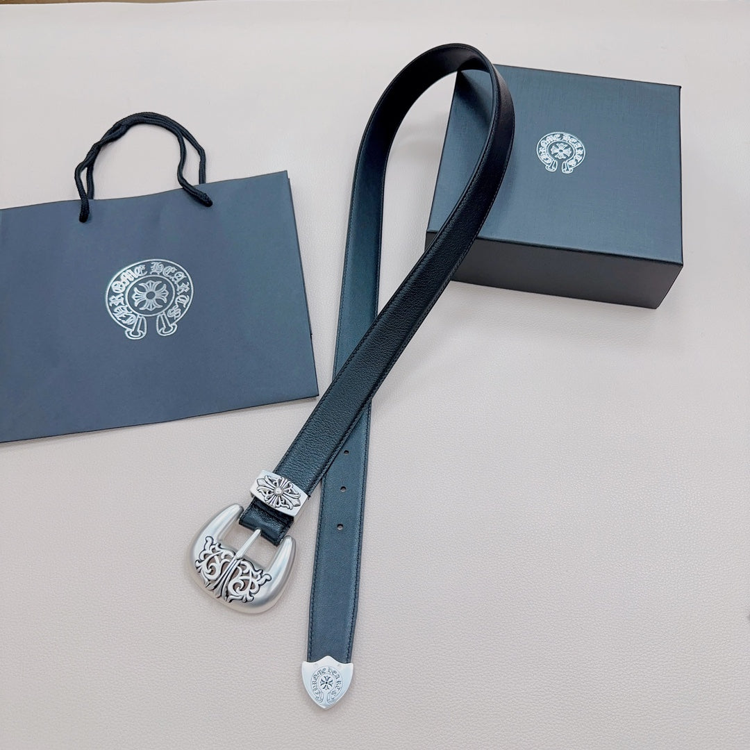 Dark blue leather belt laid out with silver engraved buckle and decorative keeper at one end.