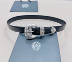 Dark blue leather belt with silver buckle and decorative center plate; includes metal keeper.