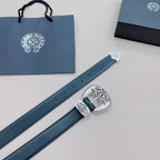 Dark blue leather belt with silver buckle and engraved keeper; strap end with metal tip shown.