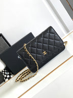 Quilted black leather flap shoulder bag with gold-tone chain strap and logo badge