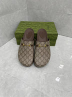 Gucci GG slide sandals, beige canvas with gold buckle hardware and cushioned dark footbed