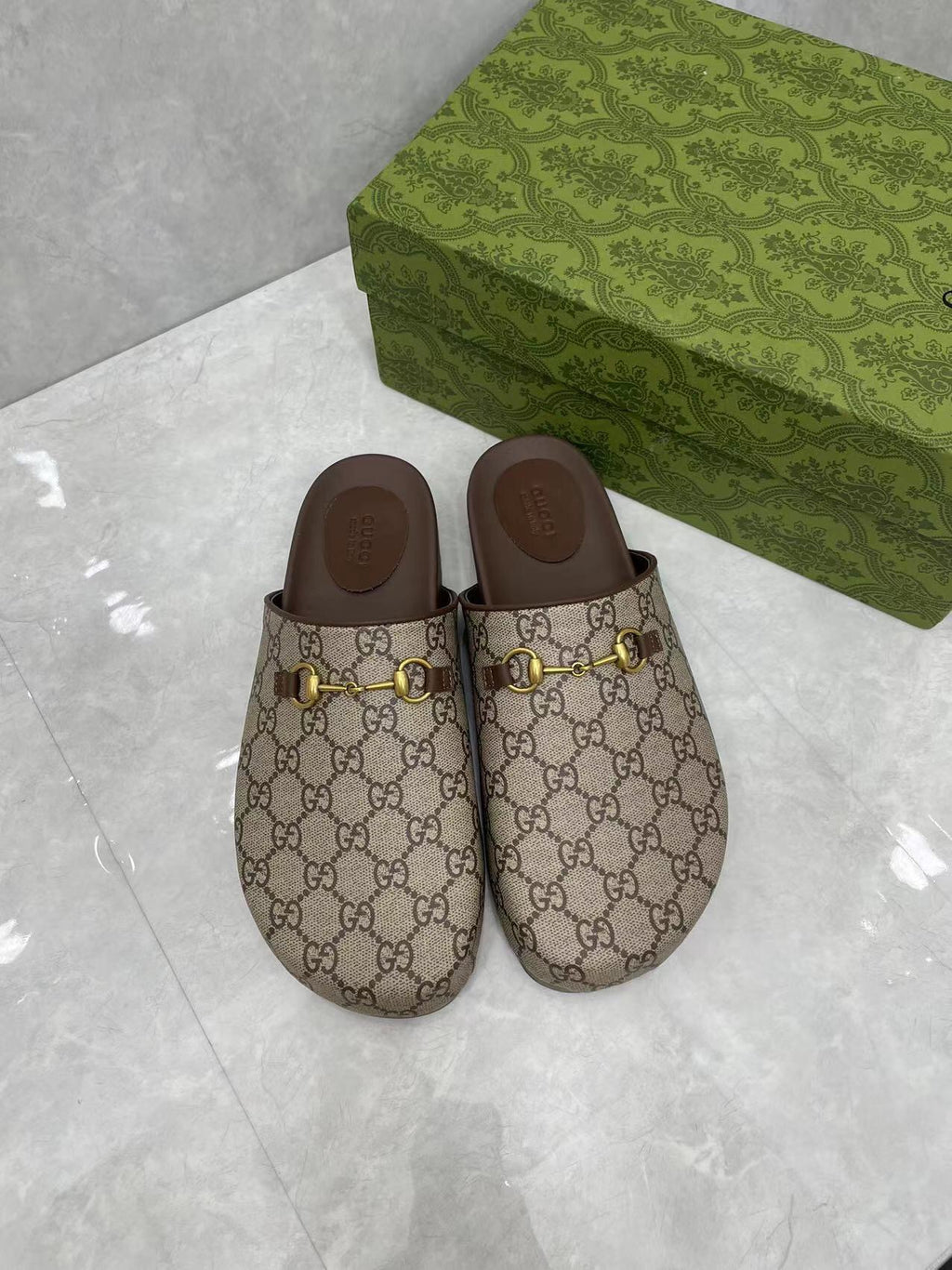 Gucci GG slide sandals, beige canvas with gold buckle hardware and dark brown inner sole