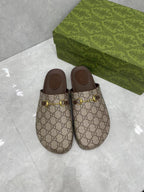 Gucci GG slide sandals, beige canvas with gold buckle hardware and dark brown inner sole