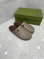 Gucci GG slide sandals, beige canvas with gold buckle strap and dark brown footbed