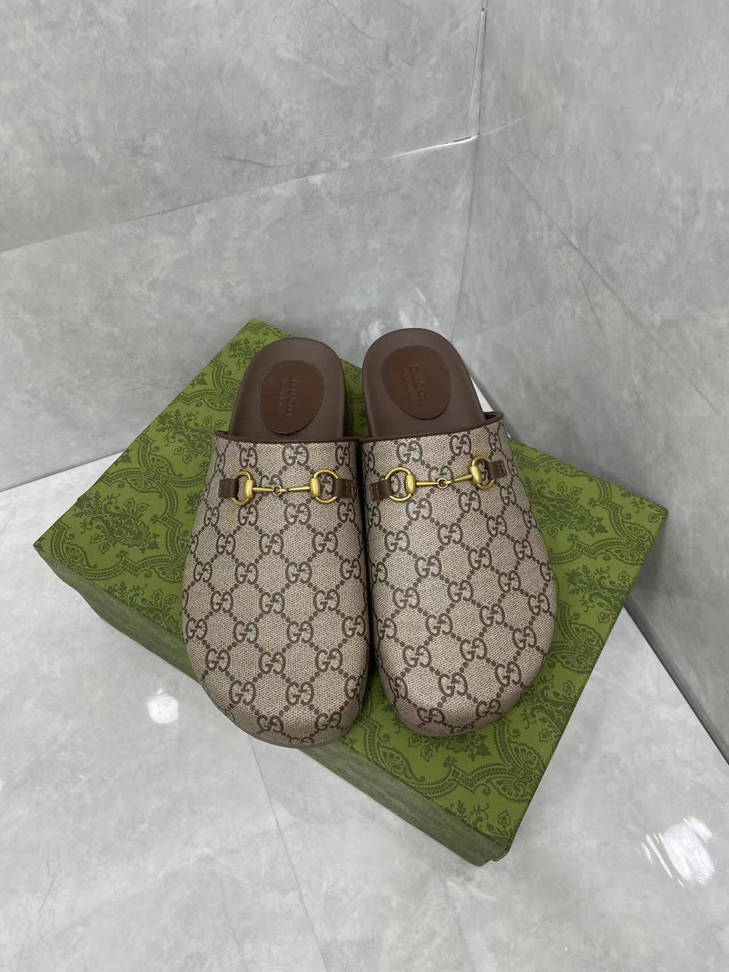 Gucci GG slide sandals, beige canvas with gold buckle hardware and dark brown footbed