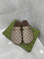 Gucci GG slide sandals, beige canvas with gold buckle hardware and dark brown footbed