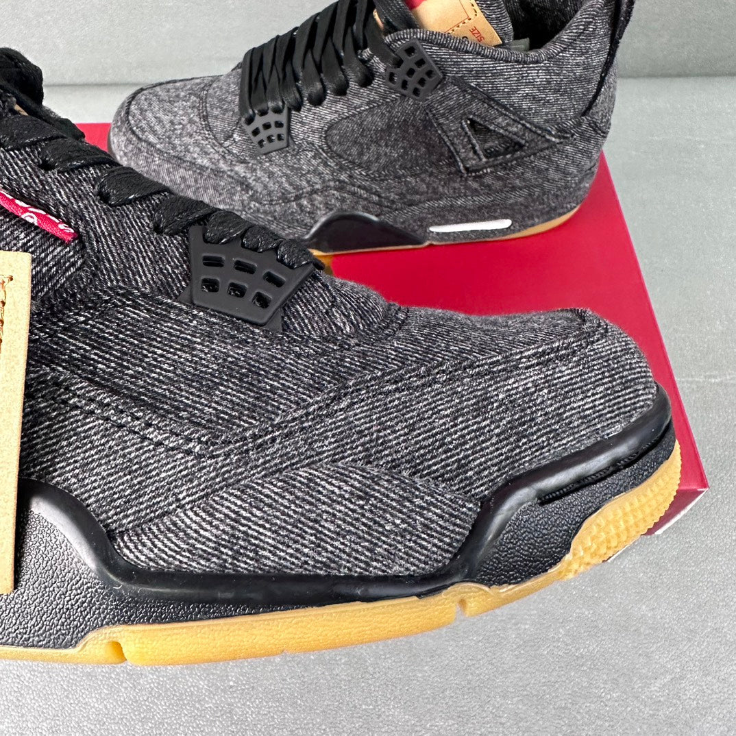 Denim high-top sneakers close-up: black netted panel, textured upper, yellow midsole trim.