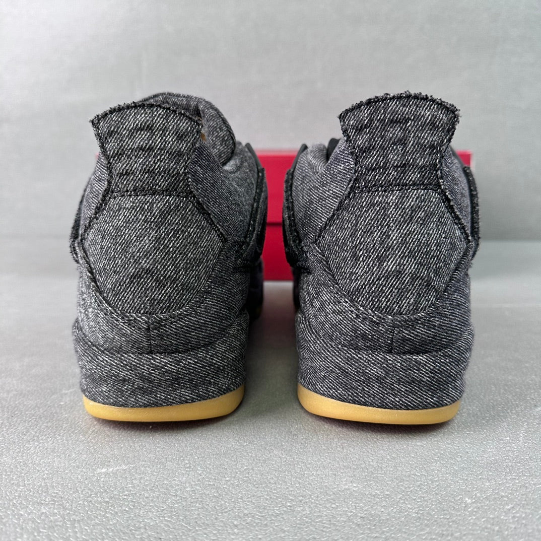 Denim high-top sneakers heel view, black sock collar, yellow gum outsole.