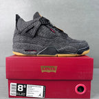 Denim high-top sneakers, black laces, yellow outsole, red lace accents, Jordan-style midsole.