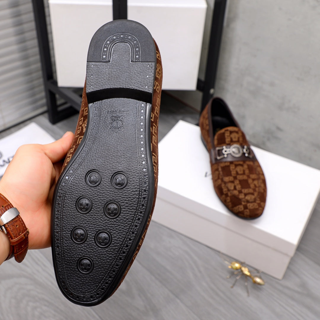 Versace luxury loafer outsole underside with circular grip details and ridged edge