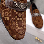 Versace luxury loafer close-up: brown monogram fabric with metal bar buckle