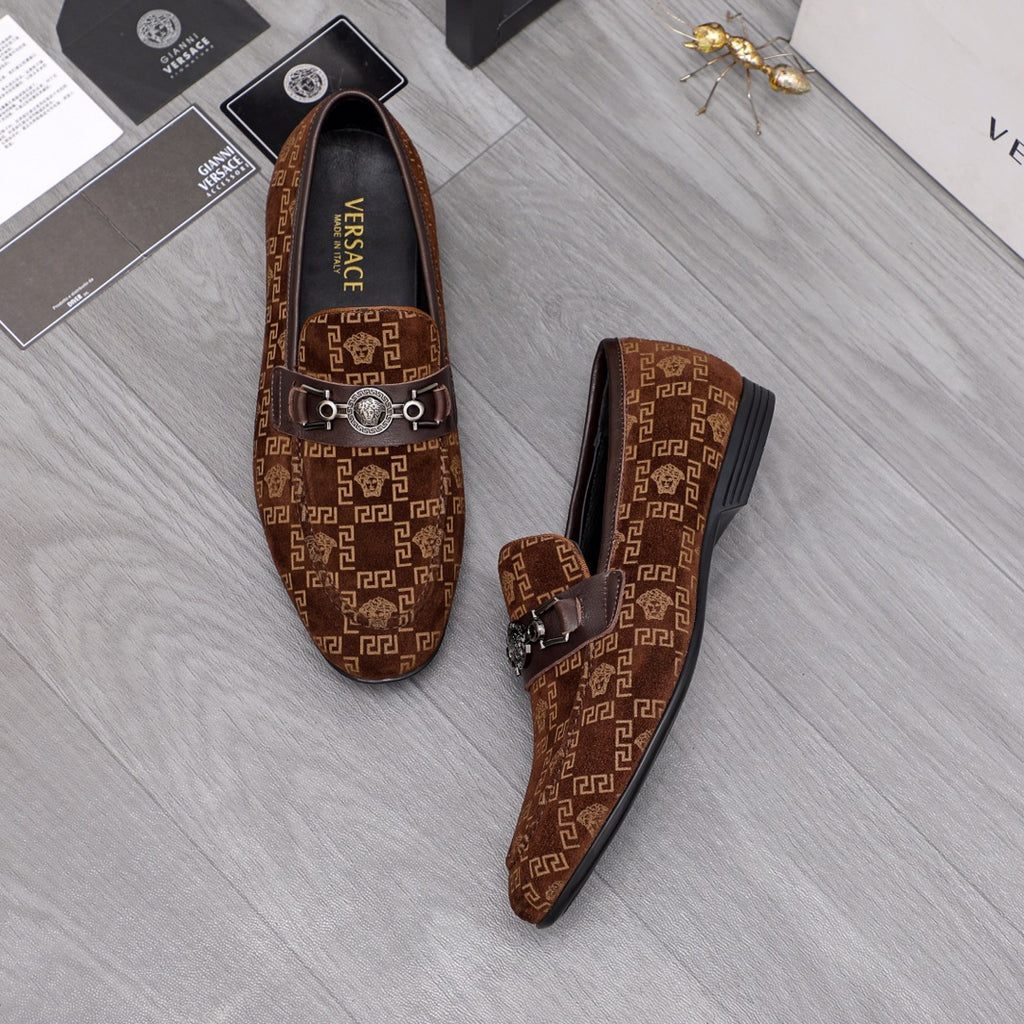 Versace luxury loafers, brown monogram pattern with front bar buckle, side view