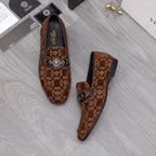 Versace luxury loafers, brown monogram pattern with front bar buckle, side view