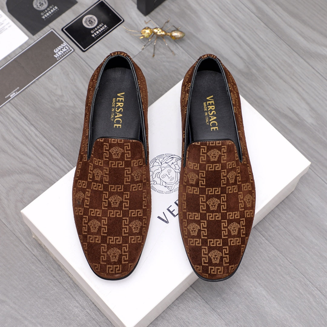 Versace luxury slip-on shoes in brown with repeating Greek key pattern, black lining.