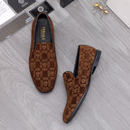 Versace luxury slip-on shoes in brown with repeating logo pattern and black lining.