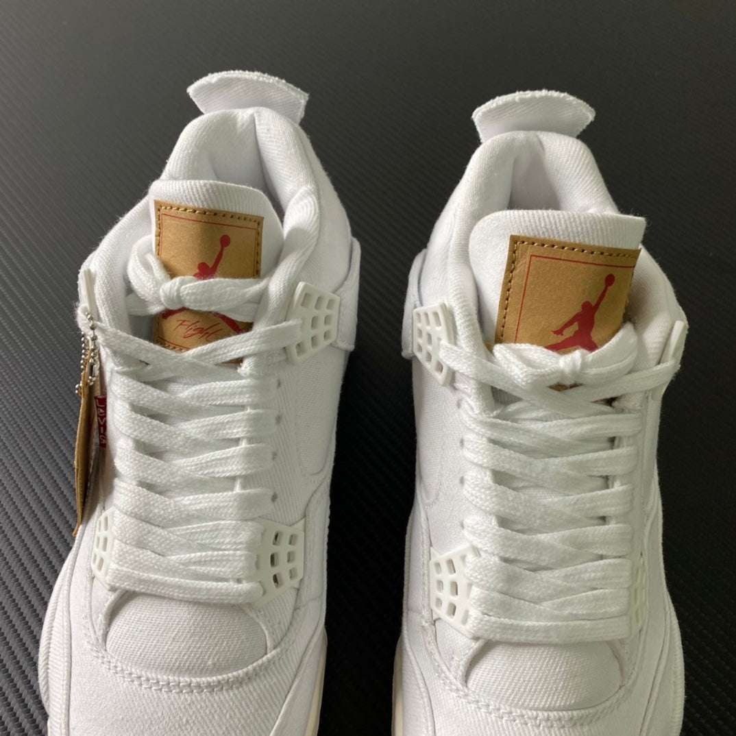 White high-top sneakers with tan heel labels and red Jumpman accents