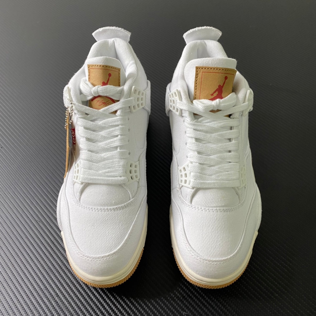 Pair of white high-top sneakers with lace-up closure and gum rubber soles